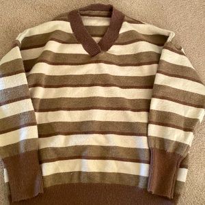 Cozy fashionable sweater with v- neck.